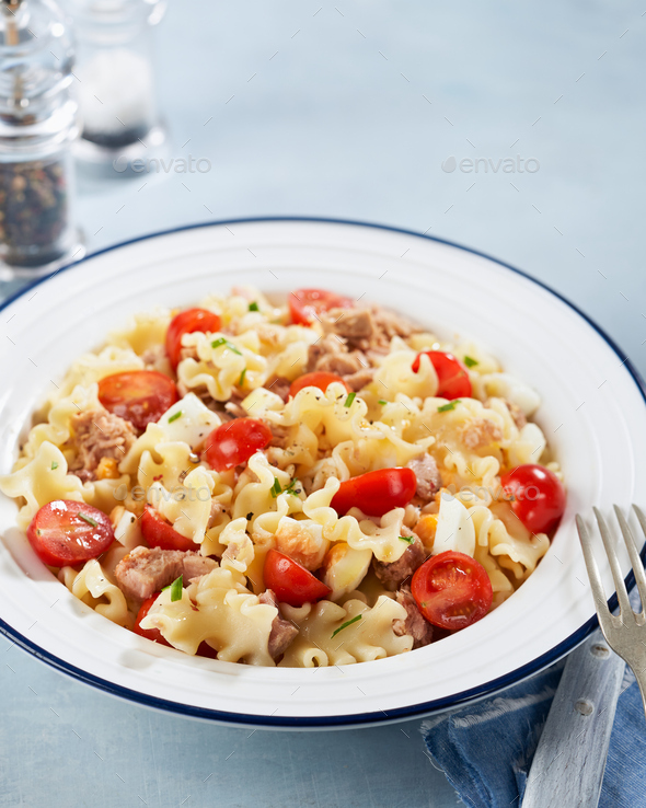 Healthy Fusilli or rotini pasta salad with tuna and tomatoes. Stock